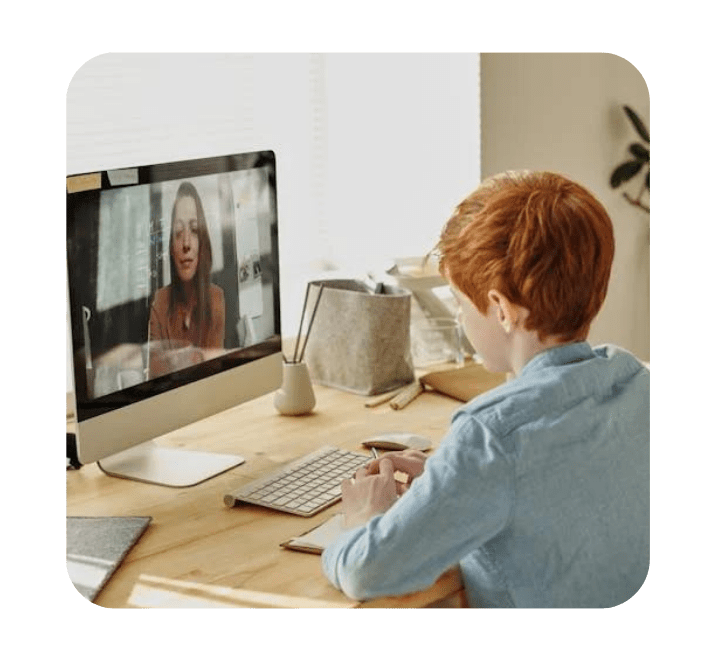 A teacher conducting a live one-on-one online robotics class with a student.